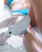 A woman gets laser hair removal